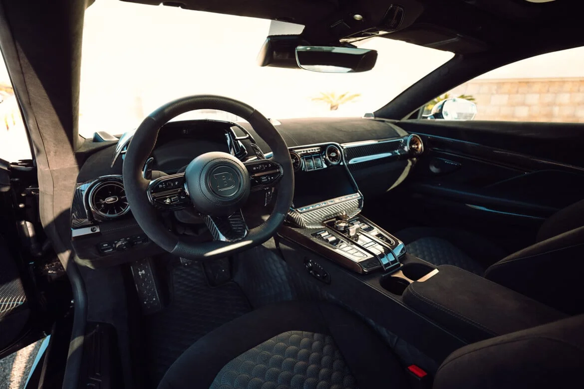 BRABUS BODO interior — alcantara dashboard, carbon-fibre console, BRABUS B steering wheel emblem