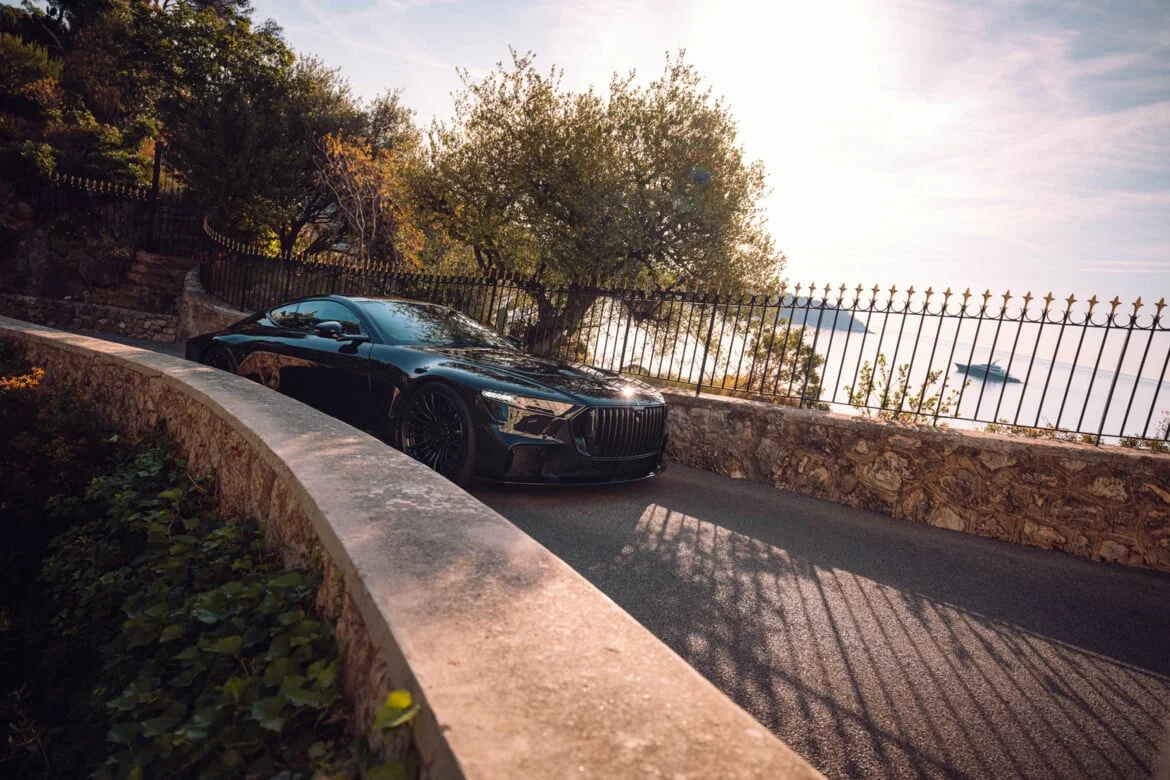 BRABUS BODO Gran Turismo on Mediterranean coastal road — side profile