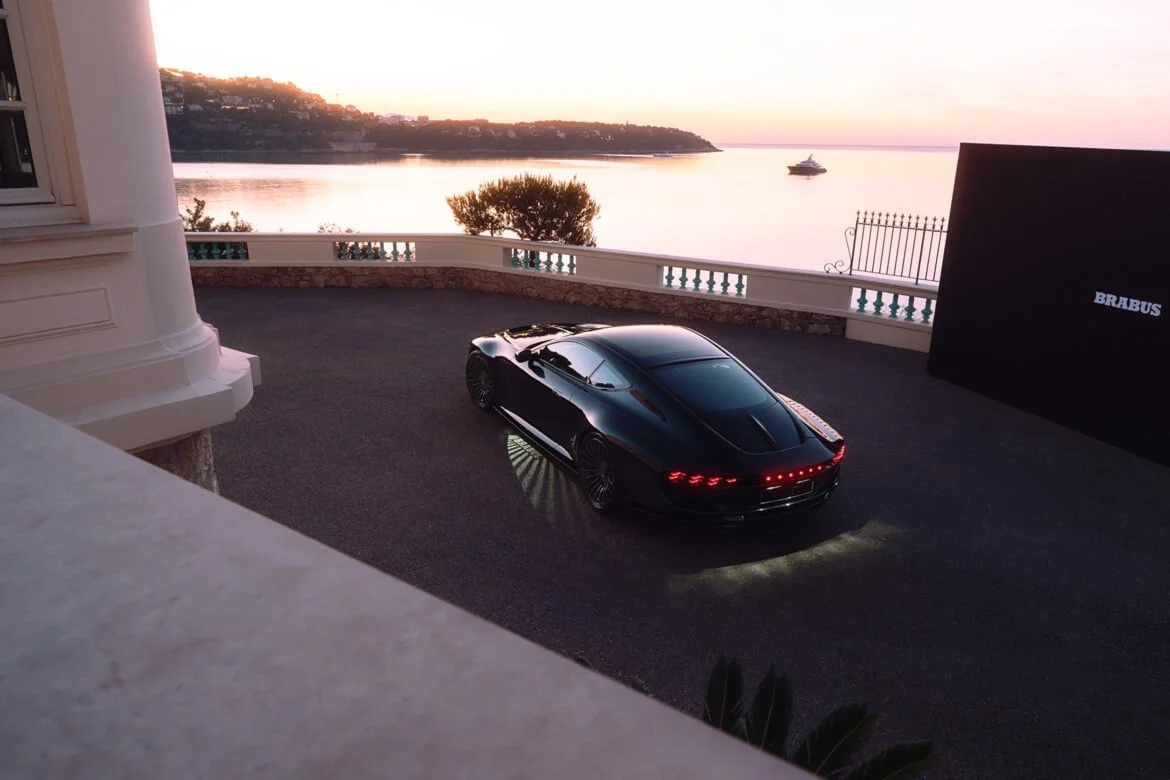 BRABUS BODO rear quarter view with illuminated taillight bar at twilight, Mediterranean villa setting
